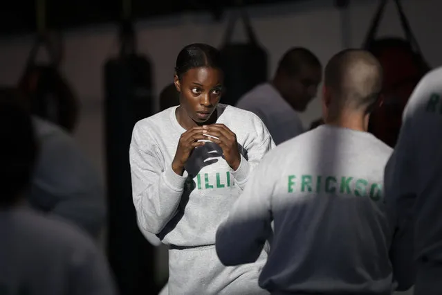 In this Friday, July 29, 2016 photo, Los Angeles County sheriff's deputy recruit Renata Phillip, center, trains with Steve Erickson during a defensive tactics class at the Biscailuz Regional Training Center in Monterey Park, Calif. Phillip is one of just two black women in her class of 84 recruits. More than half are men and most are white or Hispanic. Only three recruits out of every 100 will make it to graduation, said Capt. Scott Gage, who's in charge of training at the Los Angeles County Sheriff's Department. (Photo by Jae C. Hong/AP Photo)