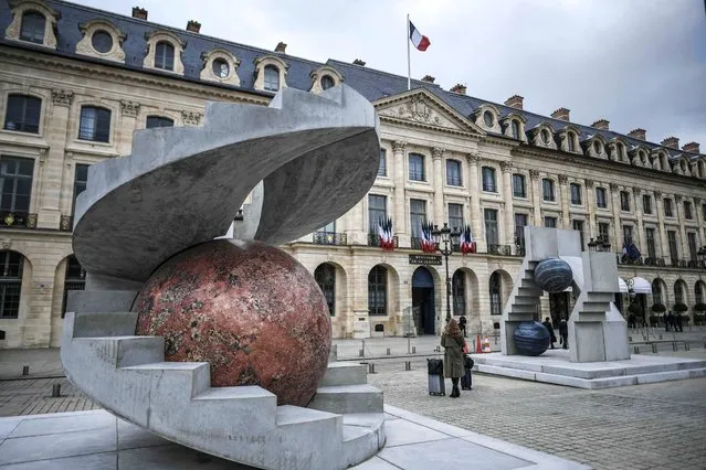 This photograph taken on October 18, 2022, shows a giant installation by artist Alicja Kwade at The Place Vendome in Paris, as part of the “Art Basel Hors les Murs” event, ahead of the official opening of Europe's biggest contemporary art market. (Photo by Stephane de Sakutin/AFP Photo)