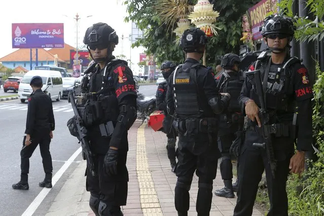 Police officers stand guard on a road leading to the venue of the G20 Summit in Nusa Dua, Bali, Indonesia on Saturday, November12, 2022. (Photo by Firdia Lisnawati/AP Photo)