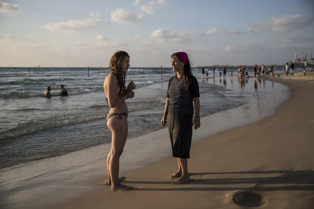 In this photo made on Thursday, Sepember 1, 2016, an Israeli Jewish woman wears modest swimsuite on the beach near the port city of Ashdod, Israel. France's burkini controversy is boosting the bottom line for Israeli makers of modest swimwear. Israel, home to large populations of conservative Jewish and Muslim women, has cultivated a local industry of modest swimsuits, and the full-body outfits that have caused uproar in France have been a common sight on Israeli beaches for several years. (Photo by Tsafrir Abayov/AP Photo)