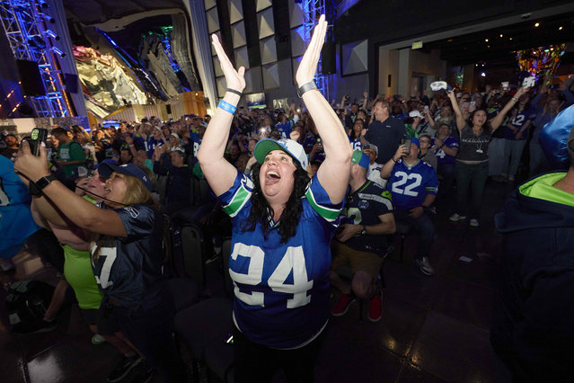 Seattle Seahawks fans react to the team's pick of North Dakota State OL Grey Zabel at No. 18 at an NFL football draft party at the Museum of Pop Culture, Thursday, April 24, 2025, in Seattle. (Photo by John Froschauer/AP Photo)