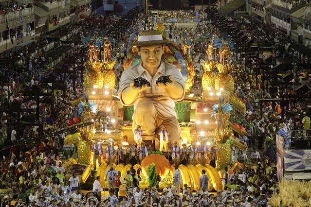 Performers from the Unidos de Vila Isabel samba school parade during Carnival celebrations at the Sambadrome in Rio de Janeiro, Tuesday, February 12, 2013. Rio de Janeiro's samba schools vied for the title of the year's best in an over-the-top, all-night-long Carnival parade at the city's iconic Sambadrome. (Photo by Hassan Ammar/AP Photo)