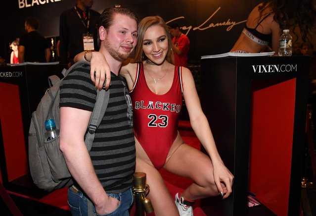 Joey Evers (L) from the Netherlands poses for photos with adult film actress Kendra Sunderland at Greg Lansky's Blacked, Tushy and Vixen adult studios booth at the 2018 AVN Adult Entertainment Expo at the Hard Rock Hotel & Casino on January 24, 2018 in Las Vegas, Nevada. (Photo by Ethan Miller/Getty Images)