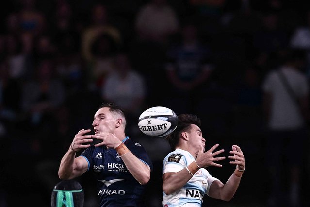 Montpellier's Thomas Vincent, left, and Racing 92's Max Spring jump to catch the ball during a rugby match in Nanterre, France, on Saturday, May 31, 2025. (Photo by Thibaud Moritz/AFP Photo)