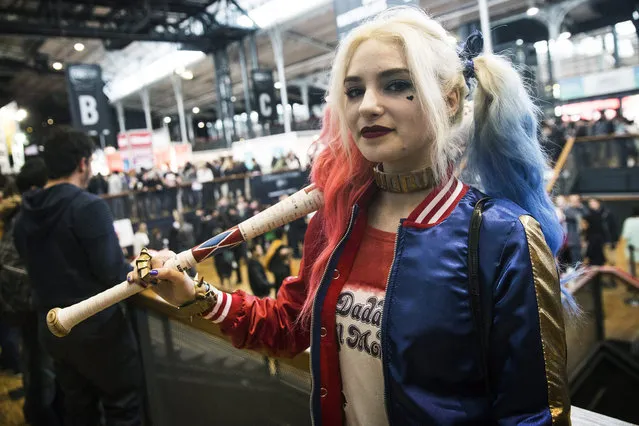 A young woman dressed up as comic book character Harley Quinn poses for photographers during the first edition of the Comic Con in Paris, France, 23 October 2015. The event runs from 23 to 25 October. (Photo by Etienne Laurent/EPA)