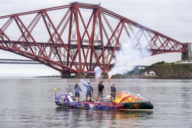 The crew of ROW4MND celebrated at the Forth Bridge, Edinburgh on Friday, August 15, 2025, as they finished their charity row to raise money for motor neurone disease research. They were inspired by Doddie Weir and Rob Burrow, rugby players who both died from the disease. (Photo by Jane Barlow/PA Images via Getty Images)