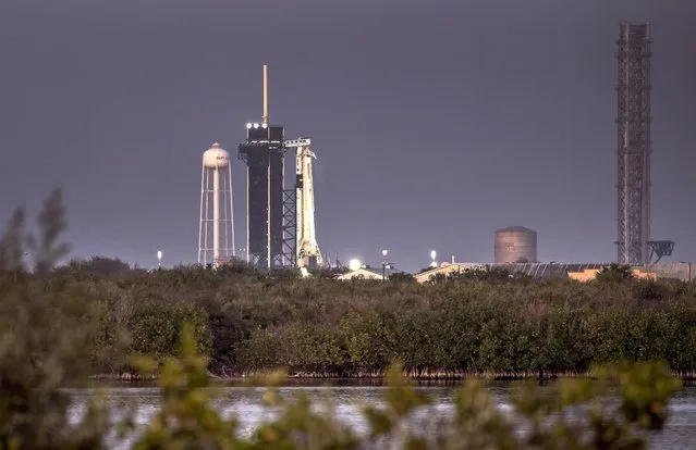 The SpaceX Falcon 9 rocket with the company's Crew Dragon spacecraft onboard is seen on the launch pad at Launch Complex 39A as preparations continue for the Crew-6 mission at NASA's Kennedy Space Center in Florida, USA, 26 February 2023. According to NASA, the SpaceX's Dragon spacecraft Endeavour, powered by the company's Falcon 9 rocket, will carry NASA astronauts Stephen Bowen and Warren 'Woody' Hoburg, UAE (United Arab Emirates) astronaut Sultan Alneyadi, and Roscosmos cosmonaut Andrey Fedyaev on a 25-hour trip to the space station. (Photo by Cristobal Herrera-Ulashkevich/EPA)