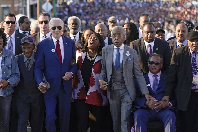 President Joe Biden begins to walk across the Edmund Pettus Bridge in Selma, Ala., Sunday, March 5, 2023, to commemorate the 58th anniversary of “Bloody Sunday”, a landmark event of the civil rights movement. With Biden is Rep. Terri Sewell, D-Ala., the Rev. Al Sharpton, the Rev. Jesse Jackson and Martin Luther King III. (Photo by Patrick Semansky/AP Photo)
