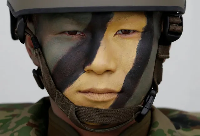 A soldier of Japanese Ground Self-Defense Force (JGSDF)'s Amphibious Rapid Deployment Brigade (ARDB), Japan's first marine unit since World War Two, is seen at JGSDF's Camp Ainoura in Sasebo, on the southwest island of Kyushu, Japan April 7, 2018. (Photo by Issei Kato/Reuters)