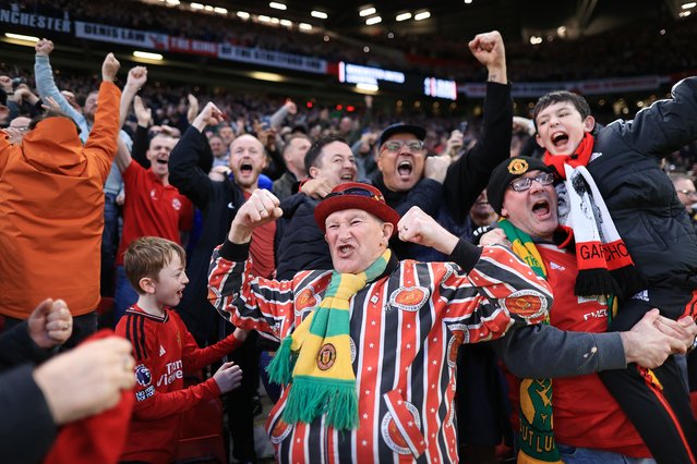 Manchester United fans celebrate after the Emirates FA Cup Quarter Final match between Manchester United and Liverpool at Old Trafford on March 17, 2024 in Manchester, England. (Photo by Simon Stacpoole/Offside/Offside via Getty Images)