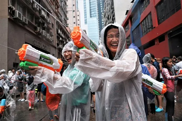 Revellers react in a water fight during Songkran Festival celebrations, in Hong Kong, China on April 9, 2023. (Photo by Lam Yik/Reuters)