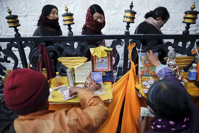 Pilgrims wait to enter the Jokhang Temple in central Lhasa, Tibet Autonomous Region, China early November 20, 2015. (Photo by Damir Sagolj/Reuters)