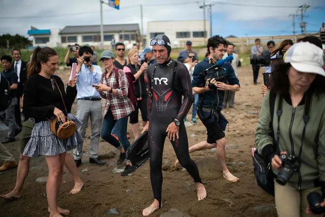 French marathon swimmer Benoit “Ben” Lecomte, takes the start of his attempt of swimming across the Pacific Ocean in Choshi, Chiba prefecture on June 5, 2018. Ben Lecomte dived into the Pacific Ocean on June 5, kicking off an epic quest to swim 9,000 kilometres (5,600 miles) from Tokyo to San Francisco, through shark- infested waters choking with plastic waste. (Photo by Martin Bureau/AFP Photo)