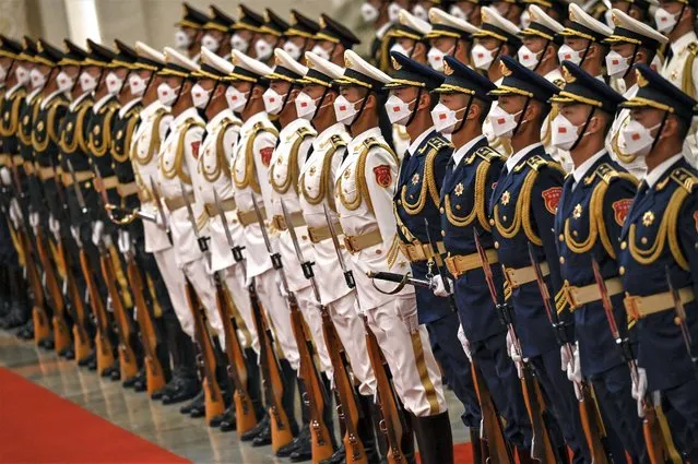 Chinese honour guards prepare for the arrival of Palestinian President Mahmud Abbas and China's President Xi Jinping at the Great Hall of the People in Beijing on June 14, 2023. (Photo by Jade Gao/Pool via AFP Photo)