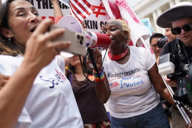 Nadine Sailer, right, argues with demonstrations against Affirmative Action in Washington, D.C. on Thursday, June 29, 2023. Demonstrators were pushed out of the area near the Supreme Court due to a suspicious bag. (Photo by Minh Connors/The Washington Post)
