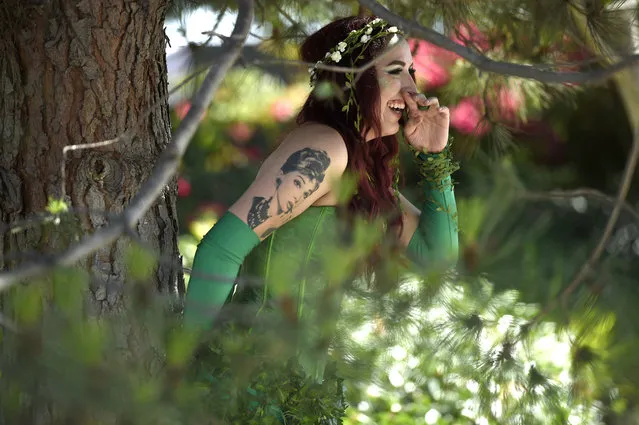 Jacey Aldredge, of San Diego, dressed as Poison Ivy, attends day one of Comic-Con International on Thursday, July 19, 2018, in San Diego.(Photo by Chris Pizzello/Invision/AP Photo)