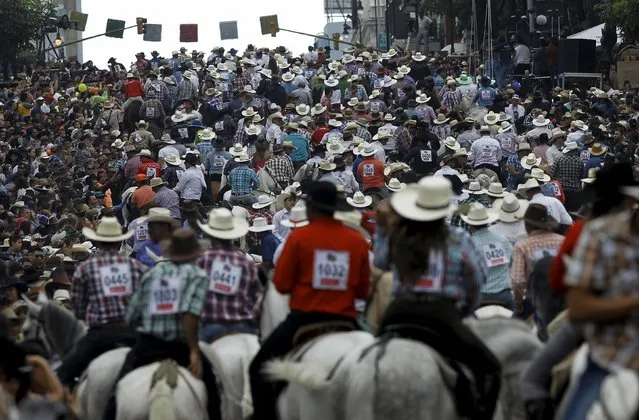 People ride horses as they take part in a traditional horse parade through the streets of San Jose, Costa Rica December 26, 2015. (Photo by Juan Carlos Ulate/Reuters)