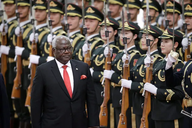 Sierra Leone's President Ernest Bai Koroma reviews honour guards during a welcoming ceremony at the Great Hall of the People in Beijing, China December 1, 2016. (Photo by Jason Lee/Reuters)
