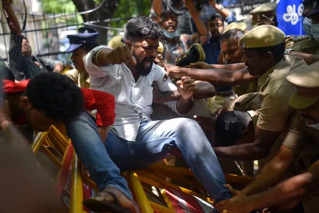 Police officers detain an activist of the Democratic Youth Federation of India (DYFI) during a protest against the Indian government's new four-year service provision of the 'Agnipath scheme' in Chennai, India, 20 June 2022. The scheme aims to deploy younger troops on the front lines by a recruitment process for personnel below the rank of officers into the three services of the armed forces. (Photo by Idrees Mohammed/EPA/EFE/Rex Features/Shutterstock)