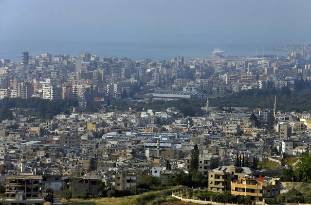In this Friday, May 5, 2017 photo, a general view, foreground, of the Ein el-Hilweh Palestinian refugee camp near the southern port city of Sidon, Lebanon. (Photo by Bilal Hussein/AP Photo)