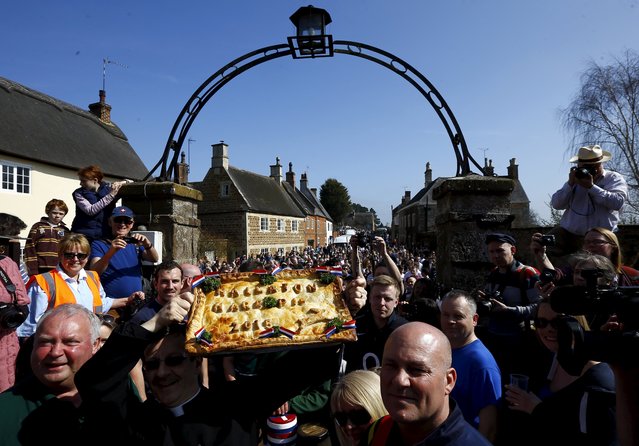A Hare pie is blessed before the bottle-kicking game in Hallaton, central England April 6, 2015. (Photo by Darren Staples/Reuters)