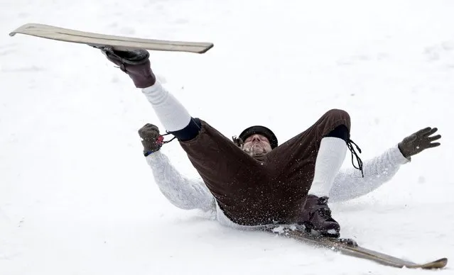 A participant falls on vintage skis during a traditional historical ski race in the northern Bohemian town of Smrzovka, Czech Republic, February 20, 2016. (Photo by David W. Cerny/Reuters)