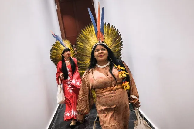 Indigenous women from the Brazilian Amazon walk after a meeting with Brazilian president-elect Luiz Inacio Lula da Silva at the 2022 United Nations Climate Change Conference (COP27), in Sharm El-Sheikh, Egypt, 17 November 2022. The 2022 United Nations Climate Change Conference (COP27), runs from 06-18 November, and is expected to host one of the largest number of participants in the annual global climate conference as over 40,000 estimated attendees, including heads of states and governments, civil society, media and other relevant stakeholders will attend. The events will include a Climate Implementation Summit, thematic days, flagship initiatives, and Green Zone activities engaging with climate and other global challenges. (Photo by Sedat Suna/EPA/EFE)