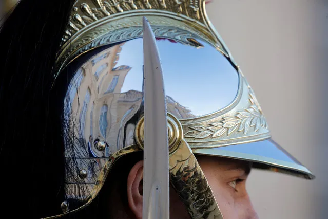 A French Republican Guard waits for a guest to arrive, on the steps of the Elysee Palace in Paris, France, February 25, 2019. (Photo by Philippe Wojazer/Reuters)