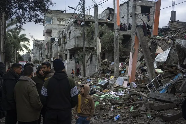 Palestinians look at the destruction after an Israeli strike in Rafah, southern Gaza Strip, Saturday, January 27, 2024. (Photo by Fatima Shbair/AP Photo)