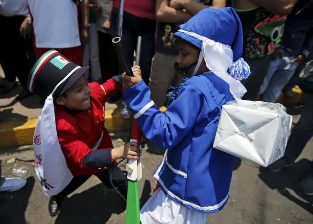Mexicans children wearing period costumes re-enact the battle of Puebla, in Mexico City May 5, 2015. (Photo by Henry Romero/Reuters)