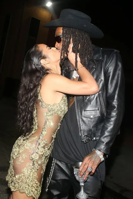American rapper Wiz Khalifa was seen wearing all leather and his new babe wearing nothing under her dress as they both share a passionate kiss outside Snoop Dogg's Birthday party in Los Angeles, CA. on October 21, 2021. (Photo by Backgrid USA)