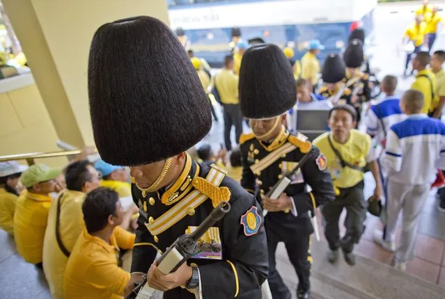 Guards in ceremonial attire arrive ahead of the coronation ceremony of King Maha Vajiralongkorn, Sunday, May 5, 2019, in Bangkok, Thailand. Saturday began three days of elaborate centuries-old ceremonies for the formal coronation of Vajiralongkorn, who has been on the throne for more than two years following the death of his father, King Bhumibol Adulyadej, who died in October 2016 after seven decades on the throne. (Photo by Gemunu Amarasinghe/AP Photo)