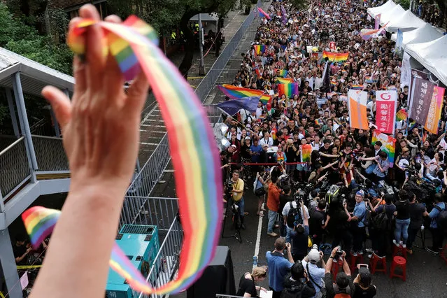 Same-s*x marriage supporters celebrate after Taiwan became the first place in Asia to legalize same-s*x marriage, outside the Legislative Yuan in Taipei, Taiwan on May 17, 2019. (Photo by Tyrone Siu/Reuters)