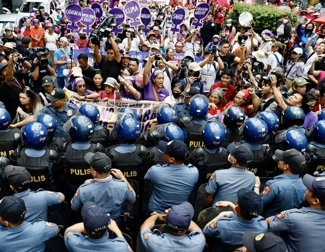 Women protesters and their supporters scuffle with anti-riot police during a protest march marking “International Women’s Day” along a street in Manila, Philippines, 08 March 2024. Feminist group, Gabriela, staged a protest rally to call for women’s rights and protections and the passage of the gender equality law in the Philippines. International Women’s Day is observed annually on 08 March, with this year’s theme “Invest in Women: Accelerate Progress”. (Photo byFrancis R. Malasig/EPA)