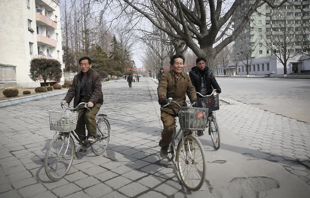 North Koreans ride their bicycles on Monday, February 22, 2016, in Kaesong, North Korea. (Photo by Wong Maye-E/AP Photo)