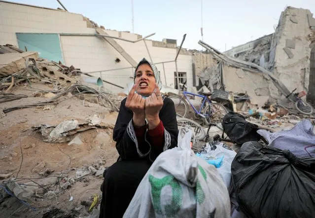 A woman reacts as she inspects damages at Al Shifa Hospital after Israeli forces withdrew from the hospital and the area around it following a two-week operation, amid the ongoing conflict between Israel and Hamas, in Gaza City on April 1, 2024. (Photo by Dawoud Abu Alkas/Reuters)