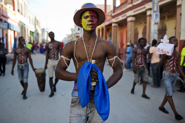 A performer promenades in the Carnival parade in Les Cayes, Haiti, Monday, February 27, 2017. (Photo by Dieu Nalio Chery/AP Photo)