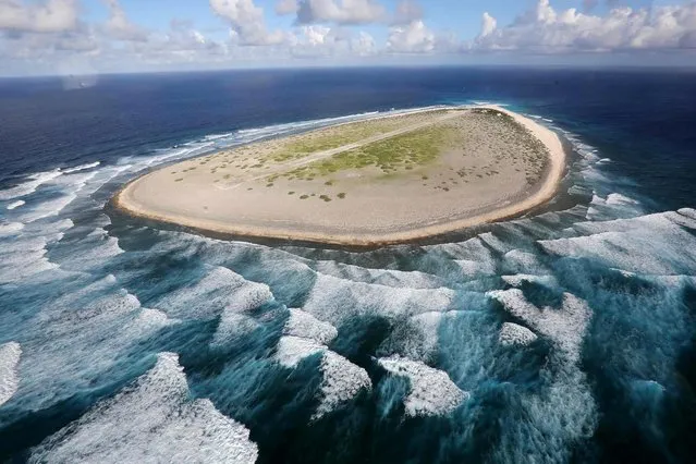 An aerial file photo taken on April 16, 2013 shows the Tromelin Island. The Musee de l'Homme in Paris, will present an exhibition on the Tromelin island and its tragic slavery story for the 70th anniversary of the Universal Declaration of Human Rights. The exhibition will take place from February 13, 2019 to June 3, 2019. (Photo by Richard Bouhet/AFP Photo)