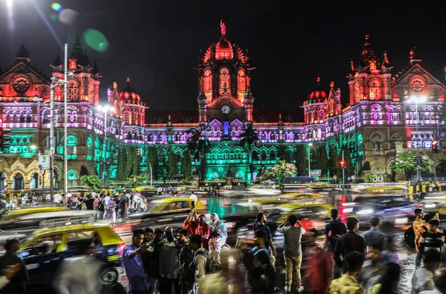 The Chhatrapati Shivaji Maharaj Terminus Railway Station is illuminated on the anniversary of Indian Independence Day in Mumbai, India, 15 August 2019. India celebrates 72 years of independence from British rule on 15 August 2019. (Photo by Divyakant Solanki/EPA/EFE)