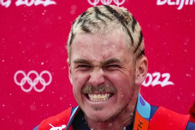 River Radamus, of the United States, celebrates after finishing the men's giant slalom run 2 at the 2022 Winter Olympics, Sunday, February 13, 2022, in the Yanqing district of Beijing. (Photo by Luca Bruno/AP Photo)