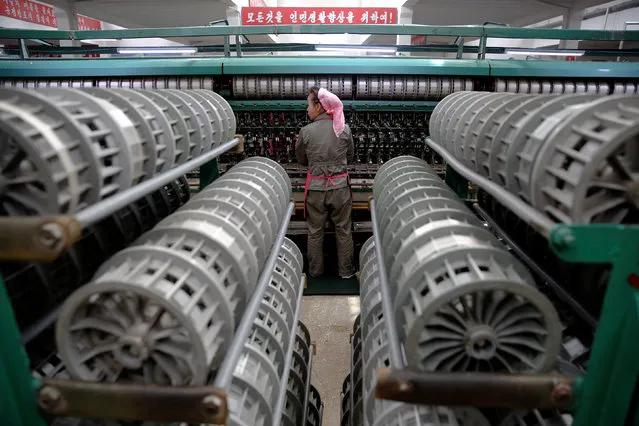 A woman works at the Kim Jong Suk Pyongyang textile mill during a government organised visit for foreign reporters in Pyongyang, North Korea May 9, 2016. (Photo by Damir Sagolj/Reuters)