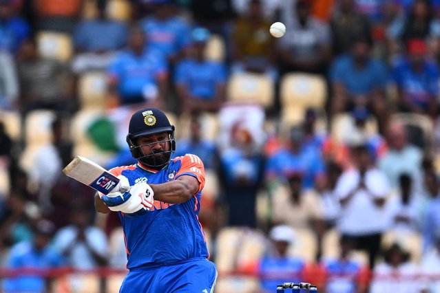 India's captain Rohit Sharma hits a 6 during the ICC men's Twenty20 World Cup 2024 Super Eight cricket match between Australia and India at Daren Sammy National Cricket Stadium in Gros Islet, Saint Lucia on June 24, 2024. (Photo by Chandan Khanna/AFP Photo)