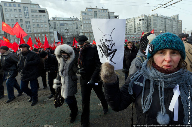 Russian oppostion activists take part in a rally and march to Bolotnaya Square on February 4, 2012 in Moscow, Russia