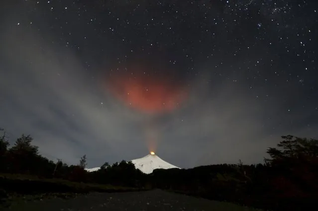 Smoke rises from Villarrica volcano as seen near the town of Pucon in southern Chile, in this June 23, 2015 file photo. (Photo by Andres Stapff/Reuters)