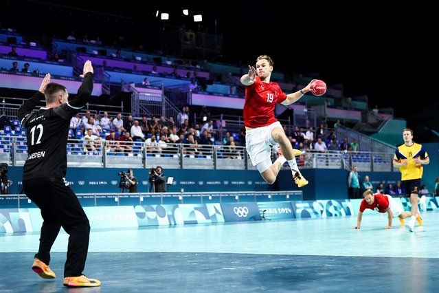 Denmark's right back #19 Mathias Gidsel shoots to score during the men's quarter-final handball match between Denmark and Sweden of the Paris 2024 Olympic Games, at the Pierre-Mauroy stadium in Villeneuve-d'Ascq, northern France, on August 7, 2024. (Photo by Sameer Al-Doumy/AFP Photo)