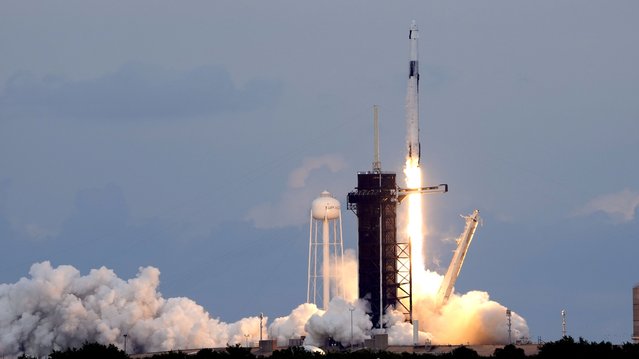 A SpaceX Falcon 9 rocket, with the Dragon capsule and a crew of four private astronauts, lifts off from Pad 39A at the Kennedy Space Center in Cape Canaveral, Fla., Sunday, May 21, 2023. (Photo by John Raoux/AP Photo)