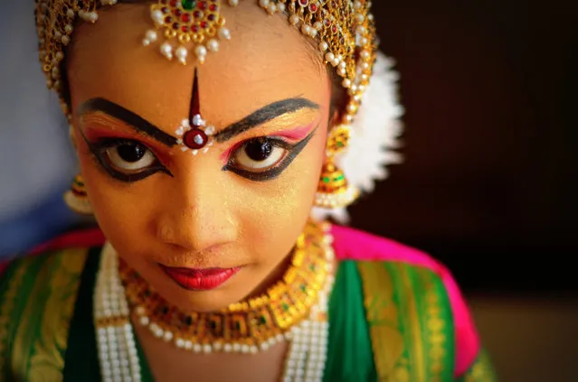 “Prodigy in the making...” This shot was taken just after her “arangetram” – her first ever public show, at the Guruvayur temple, India. Wanted to capture the colourful makeup, ornaments, silk saree and the kid's expression. Photo location: Guruvayur, Kerala, India. (Photo and caption by Jessu Paul/National Geographic Photo Contest)