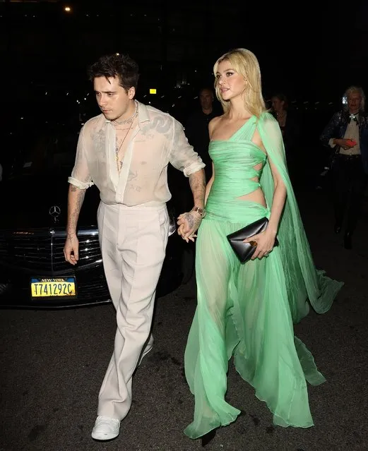 English model and photographer Brooklyn Beckham holds wife, American actress Nicola Peltz dress as they arrive to the Cipriani Met Gala after-party in New York City on May 2, 2022. (Photo by The Mega Agency)