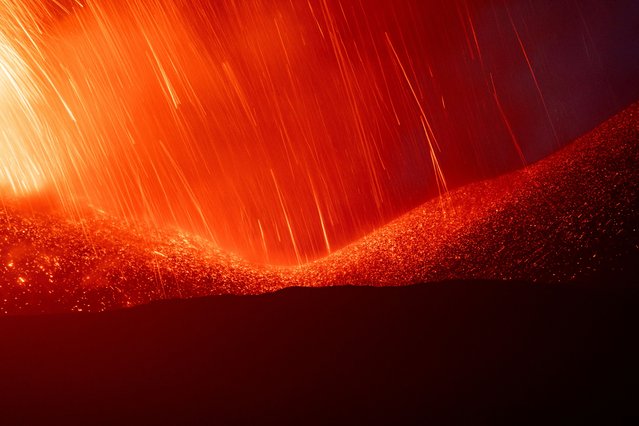 Lava spews from a crater of Mount Etna, Europe's most active volcano, Italy on July 7, 2024. (Photo by Giuseppe Di Stefano/Etna Walk via Reuters)