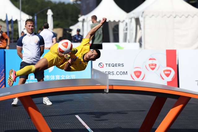 Jirati Chanliang (front) /Jutatip Kuntatong of Thailand compete during the mixed doubles round of 16 match against Kinga Barabasi/Apor Gyorgydeak of Romania at the 2024 Teqball World Series Beijing in Beijing, capital of China, September 21, 2024. (Photo by  Li Ming/Xinhua/Alamy Live News)